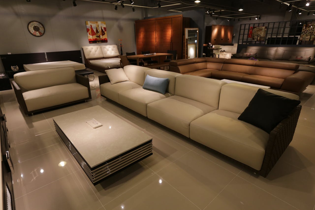 collection-05 Elegant living room showcasing modern furniture with plush sofas and ambient lighting.
